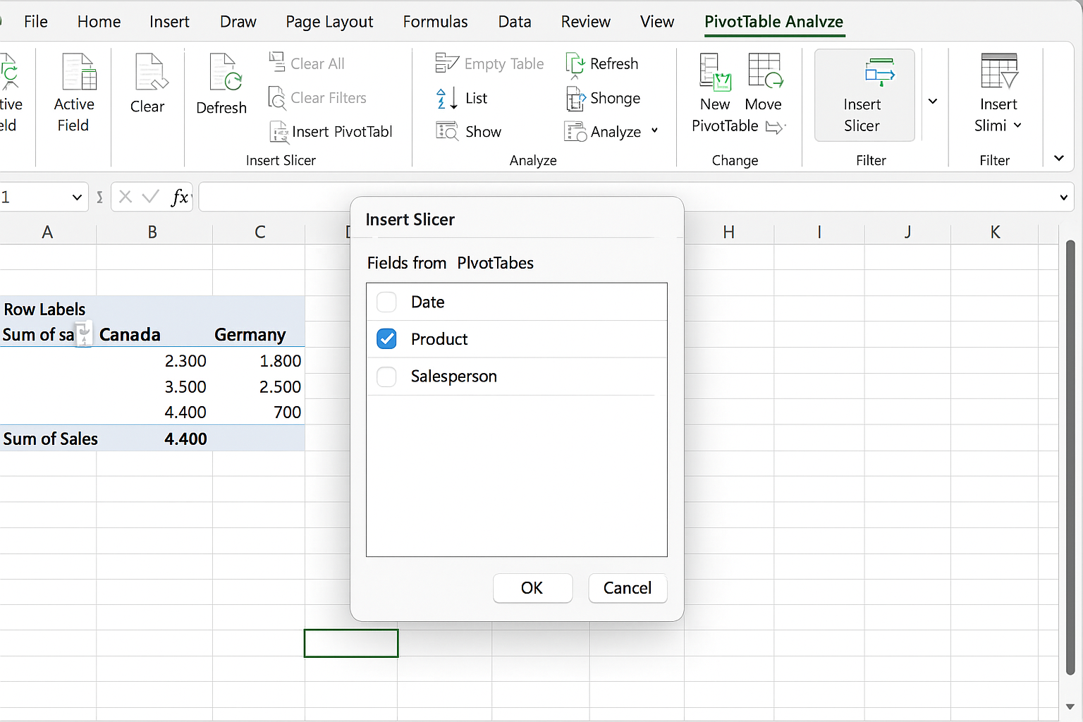 PivotTable Analyze tab open with Insert Slicer button clicked